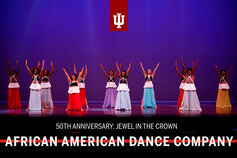 Members of the African American Dance Company perform on stage.